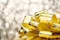 Close up Golden present box with big bow at bokeh white blur background, Leave space on top to adding your content Royalty Free Stock Photo